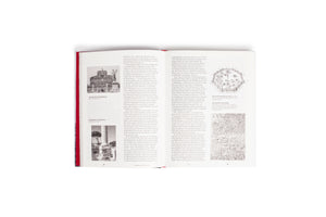 An overhead view of an open hardcover book with a red spine. The two-page spread features German text alongside black-and-white images and historical maps of ancient Roman architecture, including the Mausoleum of Hadrian and Trajan's Column.