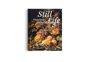 The book Still Life: Timeless Beauty stands upright against a plain white background. Its black cover features a classic still life painting with a lavish arrangement of fruits like grapes and peaches, a bird's nest with three eggs, a small bird in flight, and various insects.