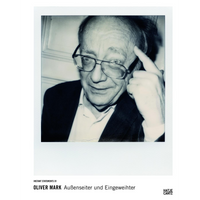 A black-and-white Polaroid-style photograph serves as the cover for a book by Oliver Mark titled Außenseiter und Eingeweihter. The photo is a close-up portrait of an older man with glasses, who is smiling and pointing his index finger to his temple. The book is part of the Instant Statements 01 series from publisher Hatje Cantz.
