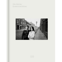 The off-white cover of Ute Mahler's photobook Zusammenleben, featuring a black-and-white photograph of two young people standing close together on a cobblestone street.