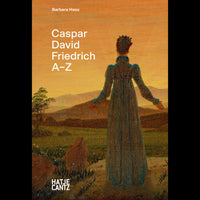The book cover for Caspar David Friedrich A-Z by Barbara Hess, featuring a Romantic painting of a woman in a long dress, viewed from behind as she looks out over a hazy, mountainous landscape under an orange sky.