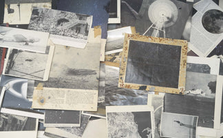 A flat lay view of a chaotic collage made from aged, black and white photographs and text from books. The layered images depict a variety of subjects, including a bombed building, an airplane, an explosion at sea, a radio telescope, the moon, a hand holding a gun, starry night skies, and ocean waves.