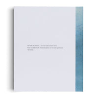 A vertical white page with a soft shadow on its left side. In the center is a block of German text by Vija Celmins that reads: Die Farbe des Himmels … ist meine! Und doch nicht meine. Kunst zu schaffen heißt, dem nachzuspüren, was wir nicht sagen können. Along the right edge of the page is a vertical band of textured, mottled blue-green, similar to a watercolor wash.