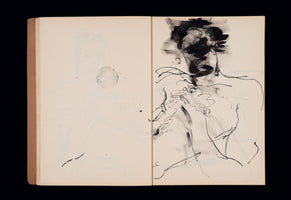 An open sketchbook on a black background. The left page contains a faint pencil sketch and a circular ink stamp. The right page features an expressive, abstract ink and wash drawing of a human figure from the chest up. The head and face are heavily obscured by dark, smudged ink, while the torso is rendered with thin, energetic, and gestural black lines.