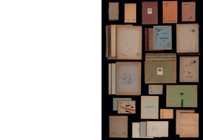 The right side of the image shows a collection of vintage notebooks and sketchpads of various sizes and colors laid out on a black background. The covers are faded brown, beige, blue, and green. Some have labels like DESSIN and CAHIER de DESSIN, and one features a small pencil sketch of an animal. The left side of the image is a large, blank white space.