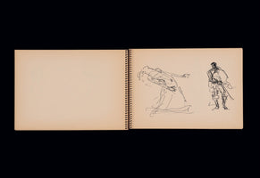 An open, spiral-bound sketchbook with tan pages lies flat against a black background. The left page is blank, while the right page features two gestural black ink drawings of human figures. The sketch on the left shows a person in a long garment bending backwards dramatically, while the sketch on the right is of a person standing, possibly in historical costume.