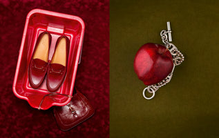 A split-screen image featuring two still-life compositions. On the left, a pair of glossy dark red loafers and a small matching handbag sit in a red plastic bucket on a red velvet background. On the right, a shiny red apple entwined with a silver chain necklace is set against an olive-green fabric background.