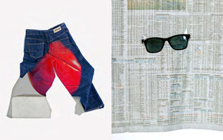 A side-by-side photo. On the left, a pair of blue jeans with a red basketball graphic on the seat is draped over a white block. On the right, a pair of black sunglasses hangs against a background of newspaper stock listings.