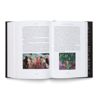 An open art book with a black hardcover lies on a white surface. The pages, numbered 630 and 631, display German text and two color reproductions of paintings. The painting on the left shows a group of people outdoors, while the one on the right is a portrait of a person in a blue patterned shawl surrounded by green foliage.